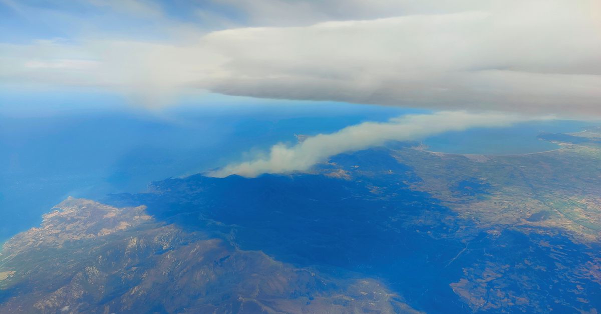An aerial view shows smoke rising from a fire in the Cerbere region